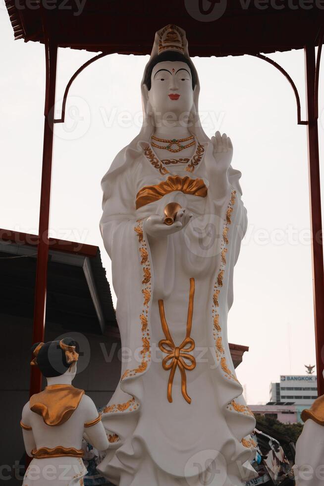 A Beautiful and Elegant White Statue of the Bodhisattva, symbolizing peace and serenity photo