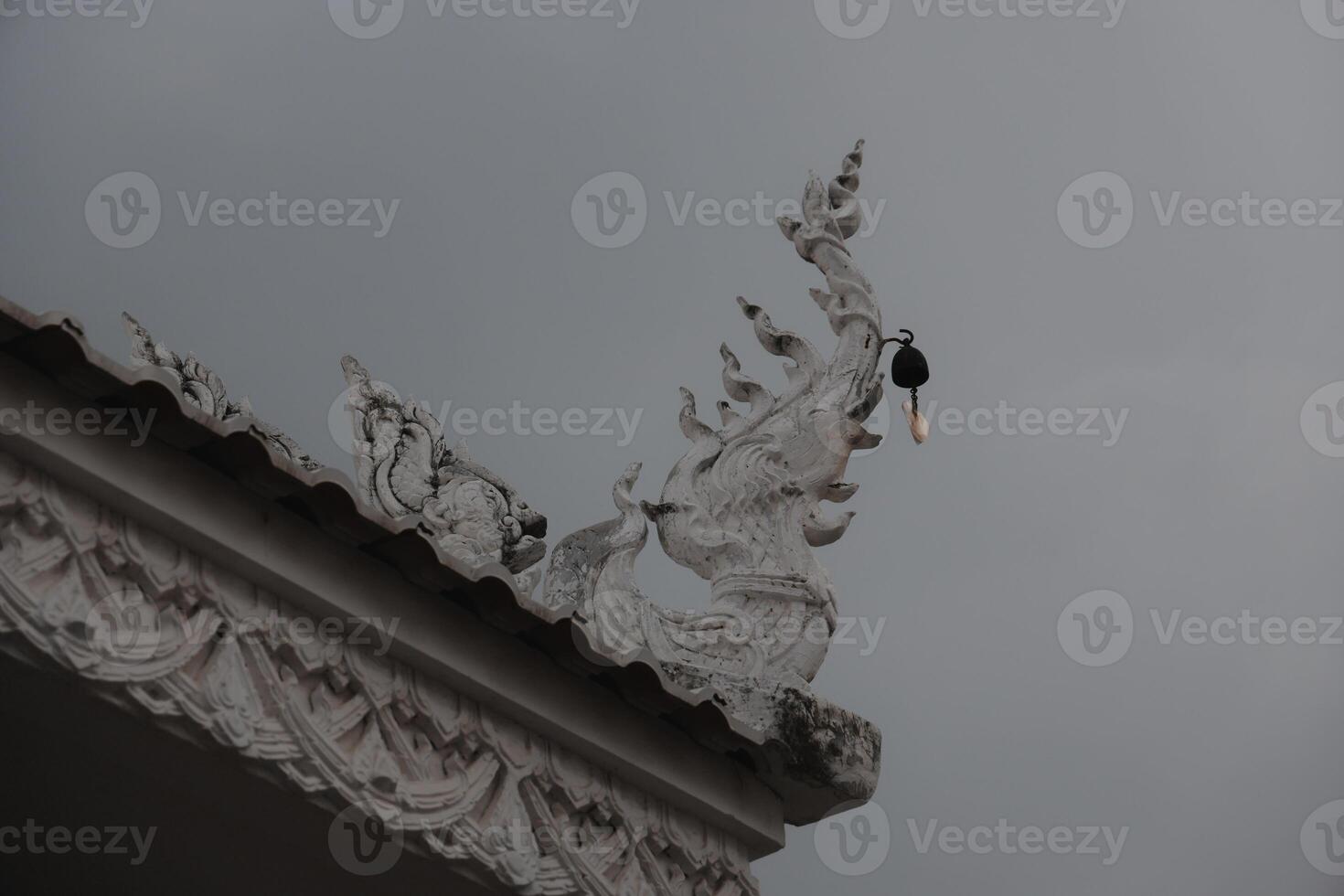 An Intricate Architectural Detail found beautifully displayed on the Roof of a Temple photo