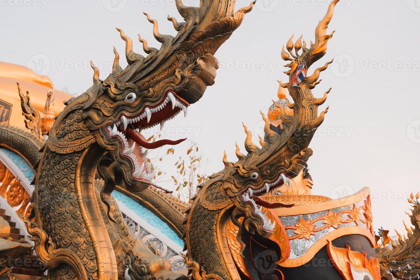 Intricate and beautifully crafted Dragon Sculpture located at a magnificent temple photo