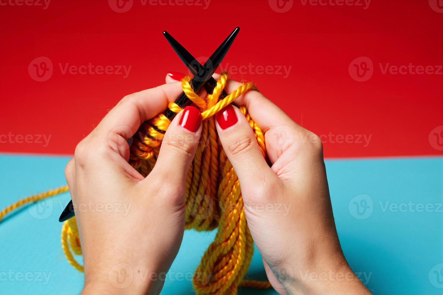 A person holding a pair of knitting needles photo