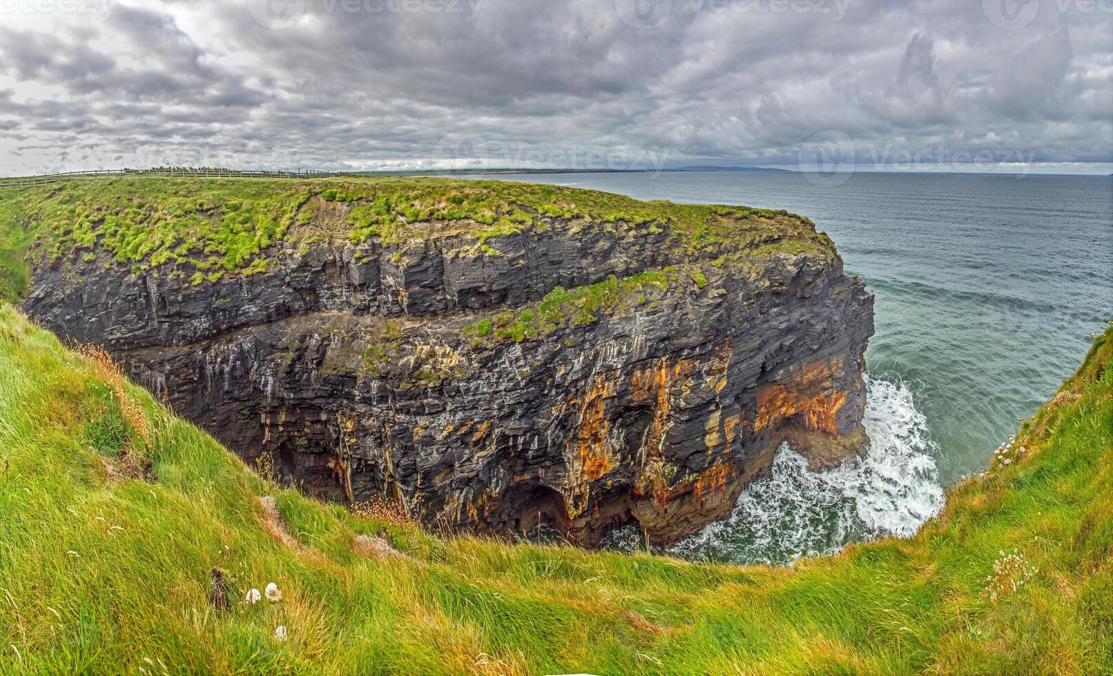 Breathtaking view of the Cliffs of Moher overlooking the Atlantic Ocean in Ireland 8 photo