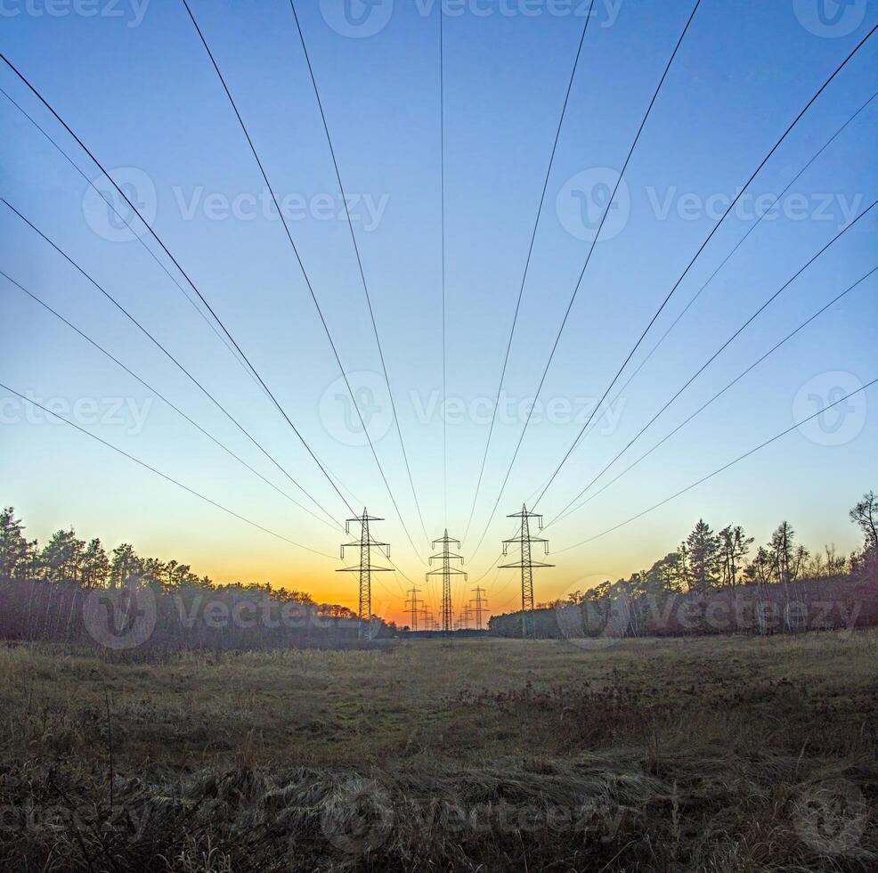 High voltage power lines over a field at sunset 4 photo