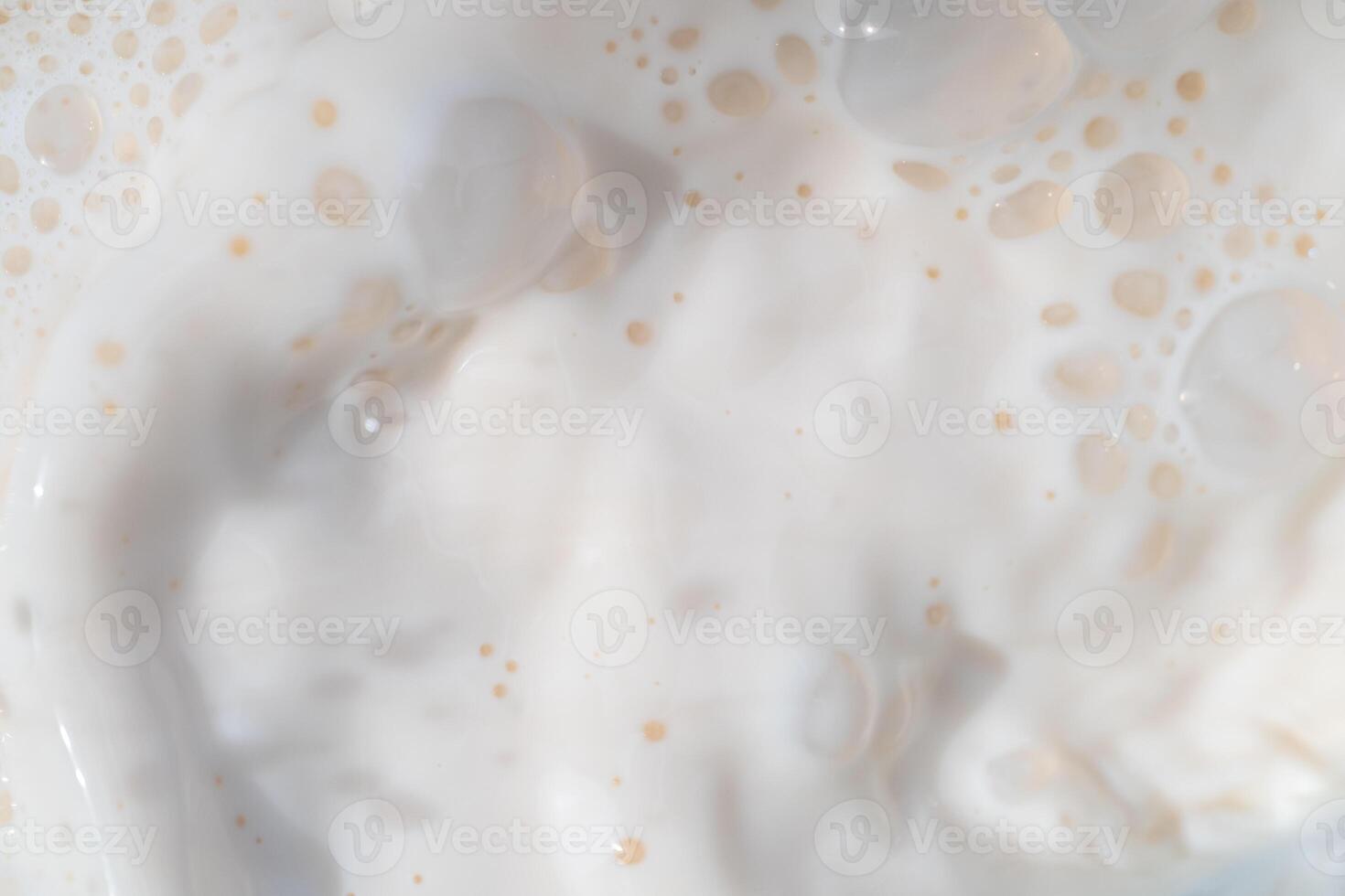 Milk water liquid white color drink and food texture background, Beautiful natural caw milk wave and bubble splash texture with macro on top view, Healthy photo