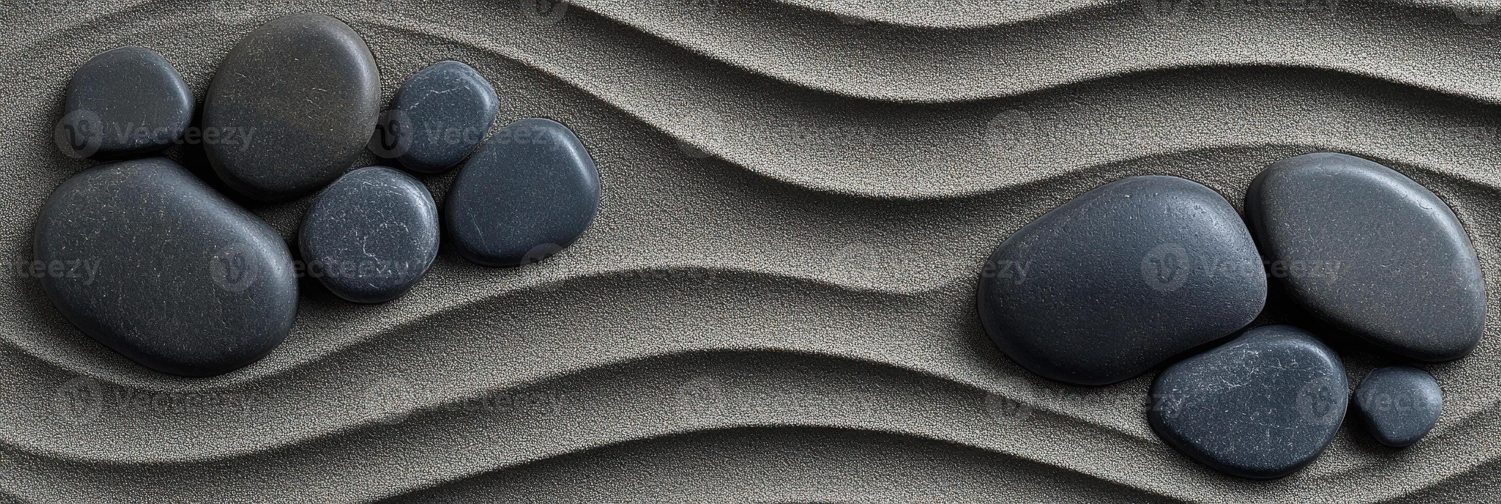 Zen garden sand pattern with smooth stones creating ripple effect photo