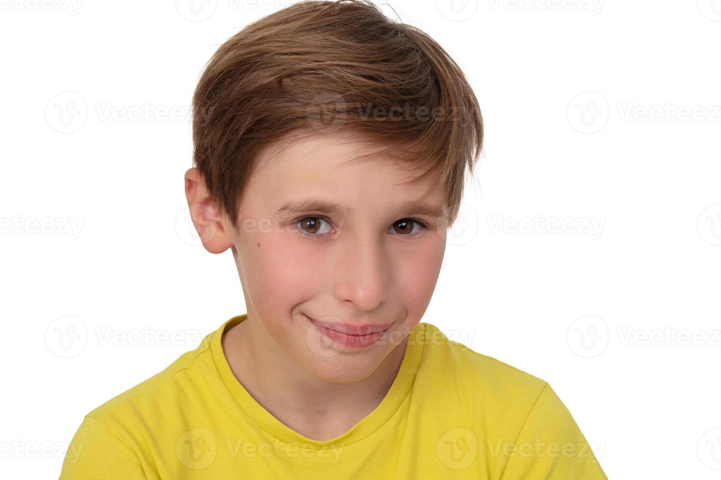 Portrait of a boy with a smile in close-up with brown eyes. Eleven years old child. photo