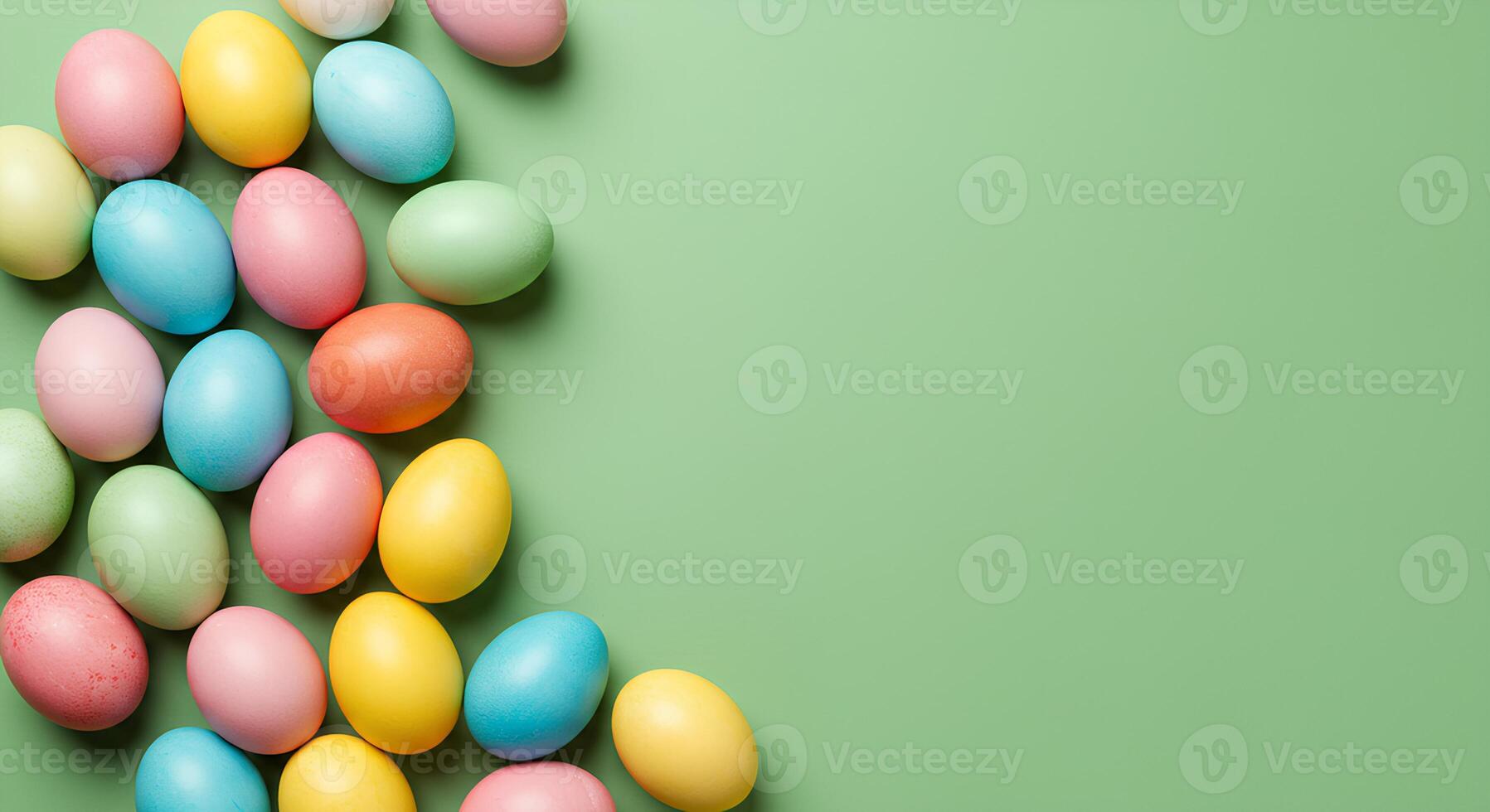 colorful easter eggs isolated on light green background for Happy Easter promotional campaigns. Happy Easter flat lay background full of colorful eggs in celebration of the holiday. Happy easter frame photo