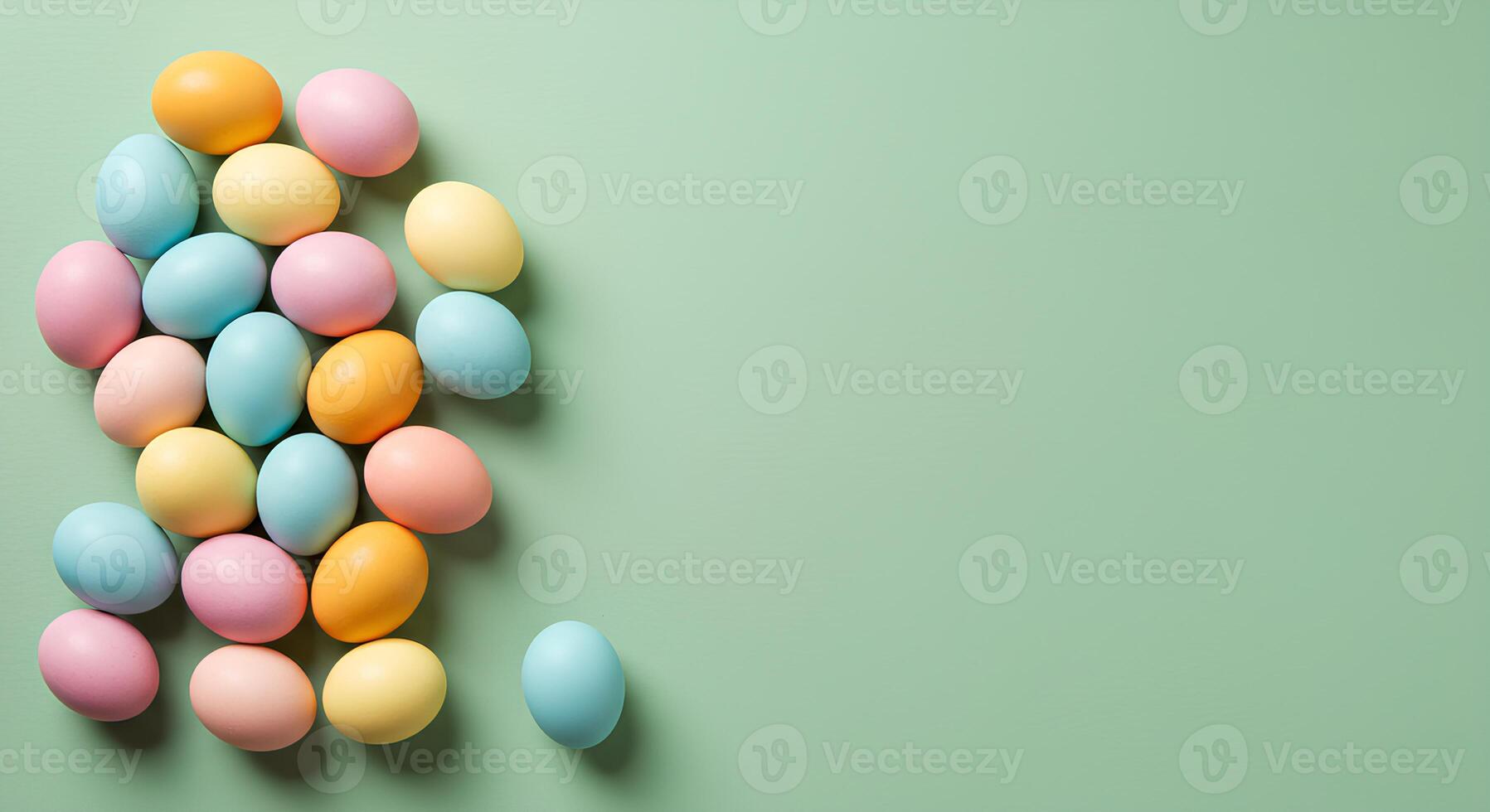 Colorful Easter Eggs Isolated on Light Green Background. Vibrant and Festive Easter Egg Flat Lay for Holiday Celebrations. Perfect for Easter promotions, greeting cards, and social media. photo