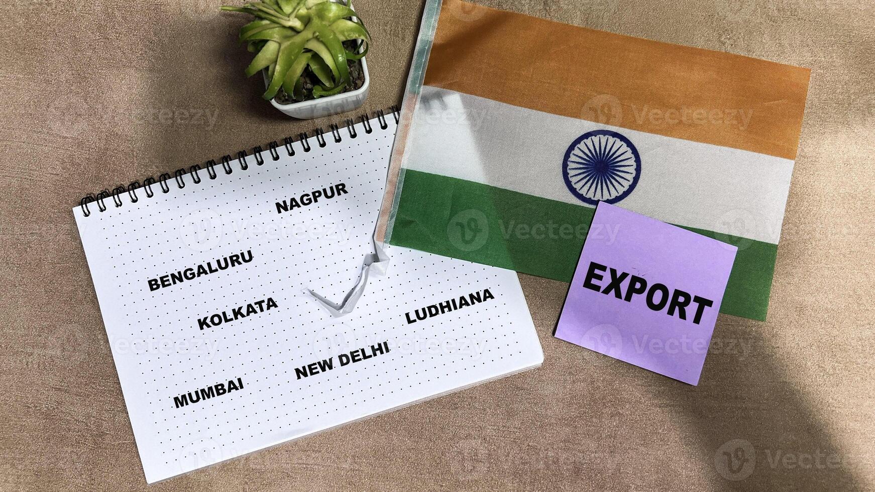 Concept of Export write on sticky notes and Flag of the India isolated on Wooden Table. photo