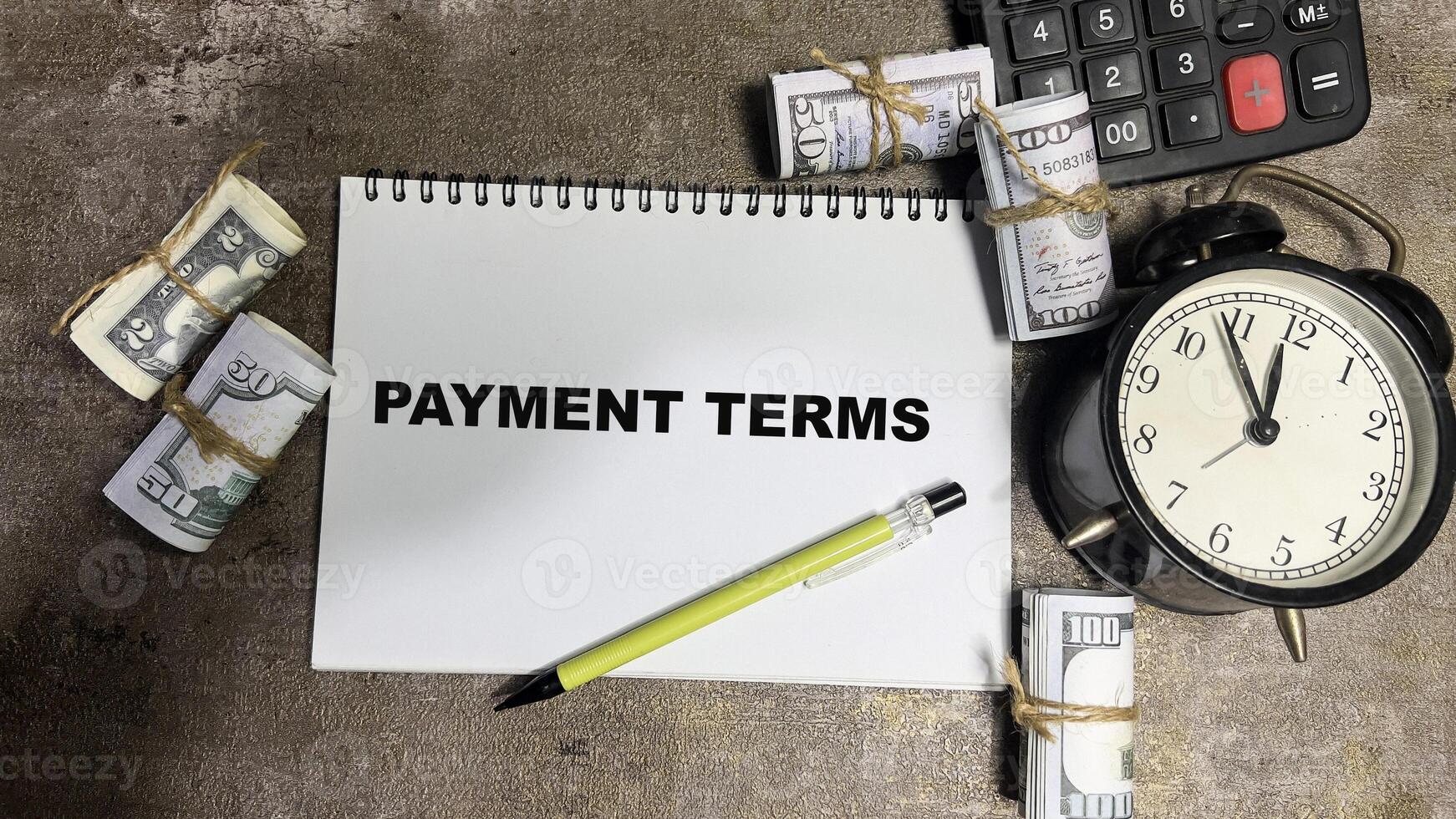 Concept of Payment Terms write on book isolated on Wooden Table. photo
