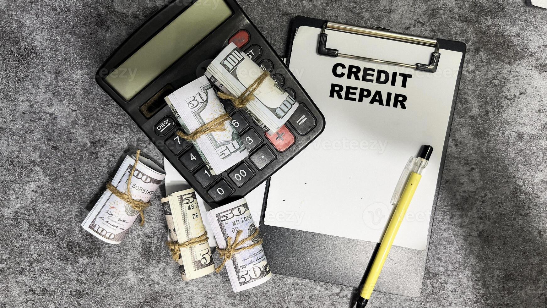 Concept of Credit Repair write on paperwork isolated on Wooden Table. photo