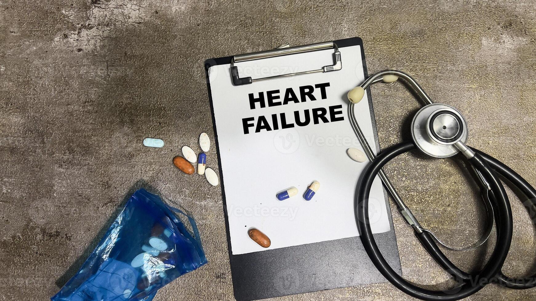 Concept of Heart Failure write on paperwork isolated on Wooden Table. photo