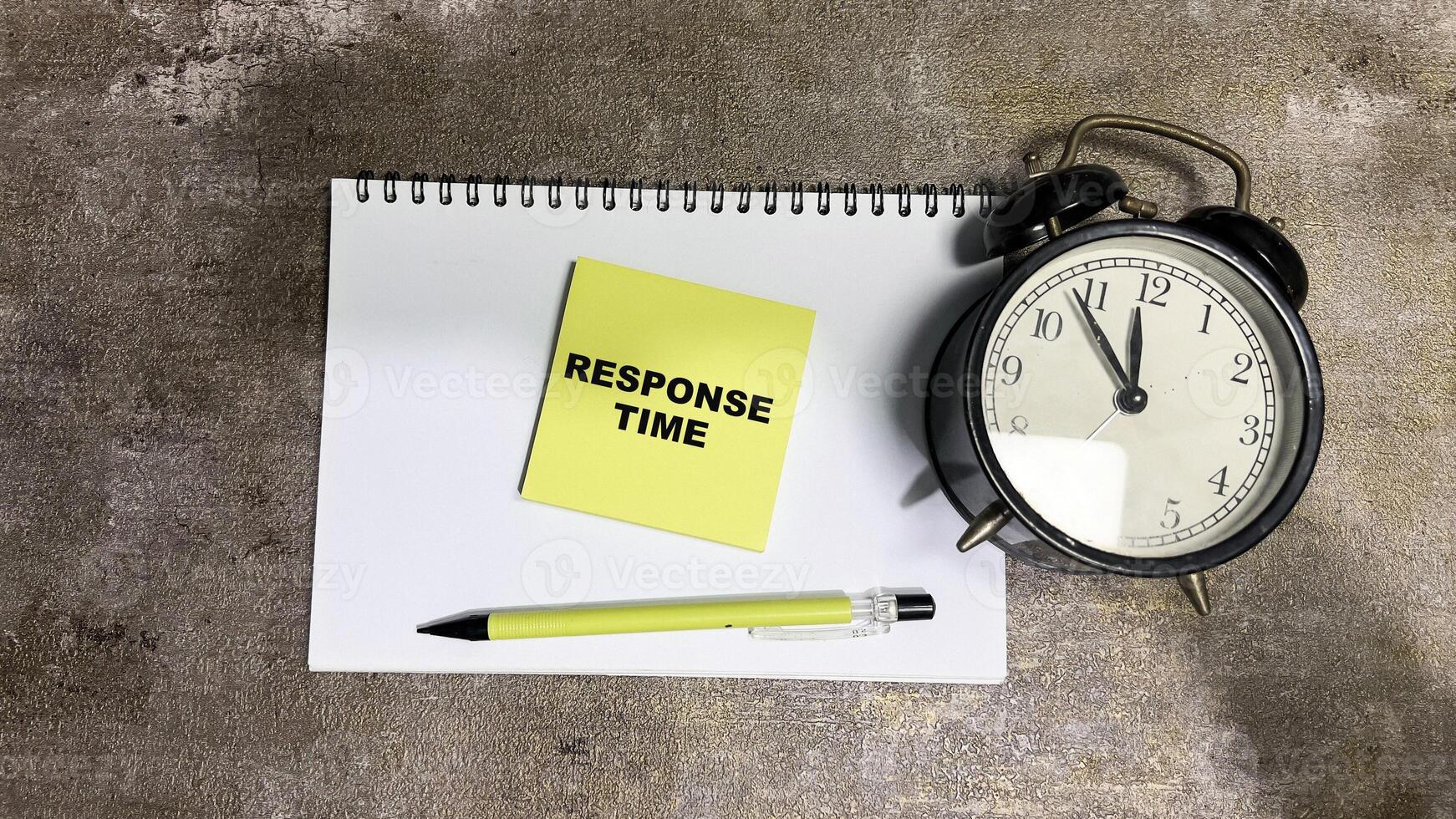 Concept of Response Time write on sticky notes isolated on Wooden Table. photo