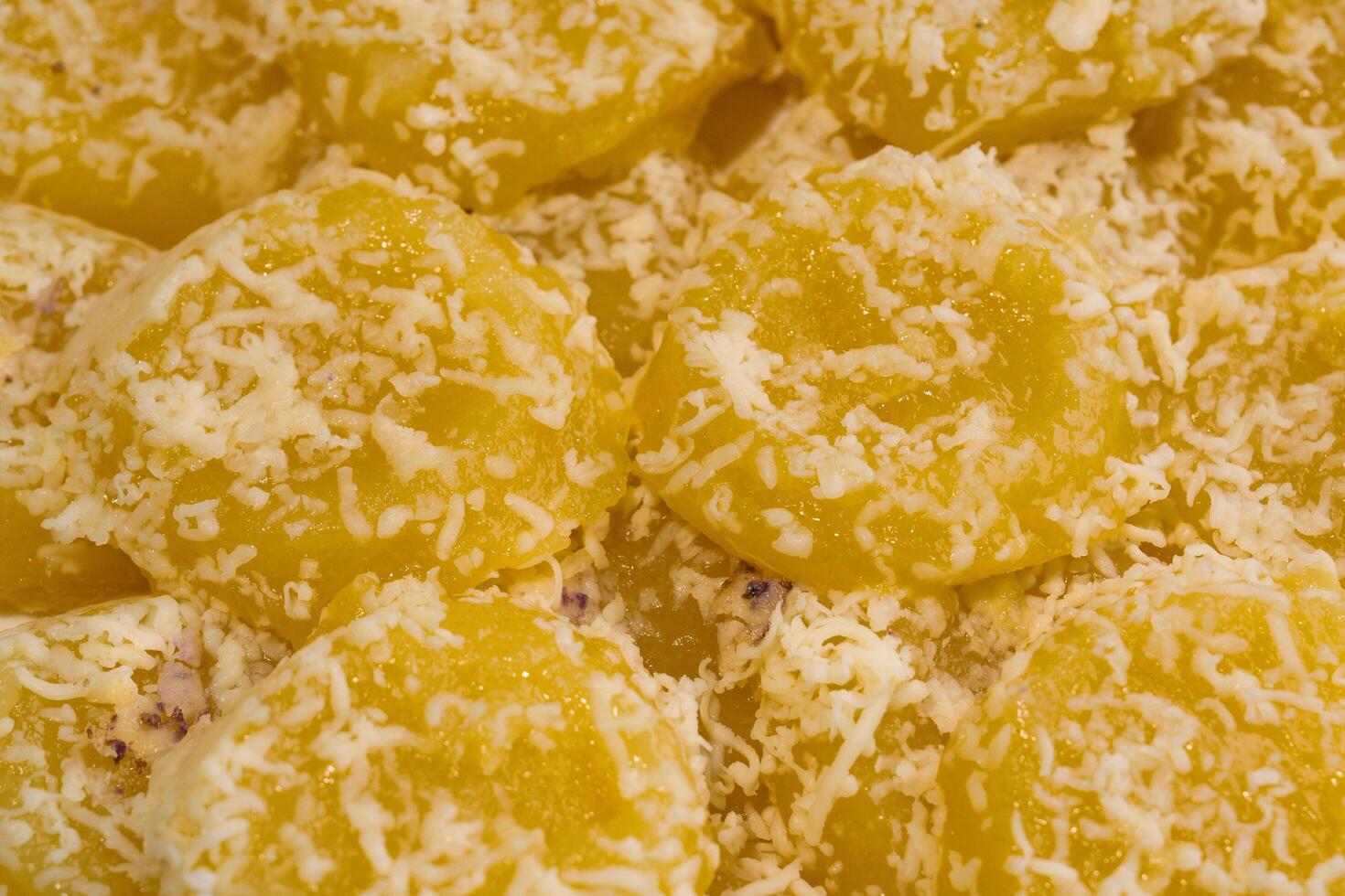 yellow kutsinta with cheese topping photo