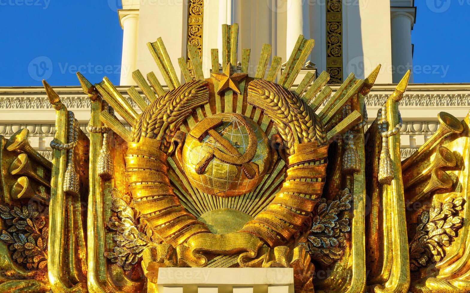 The soviet emblem on the top of a building photo