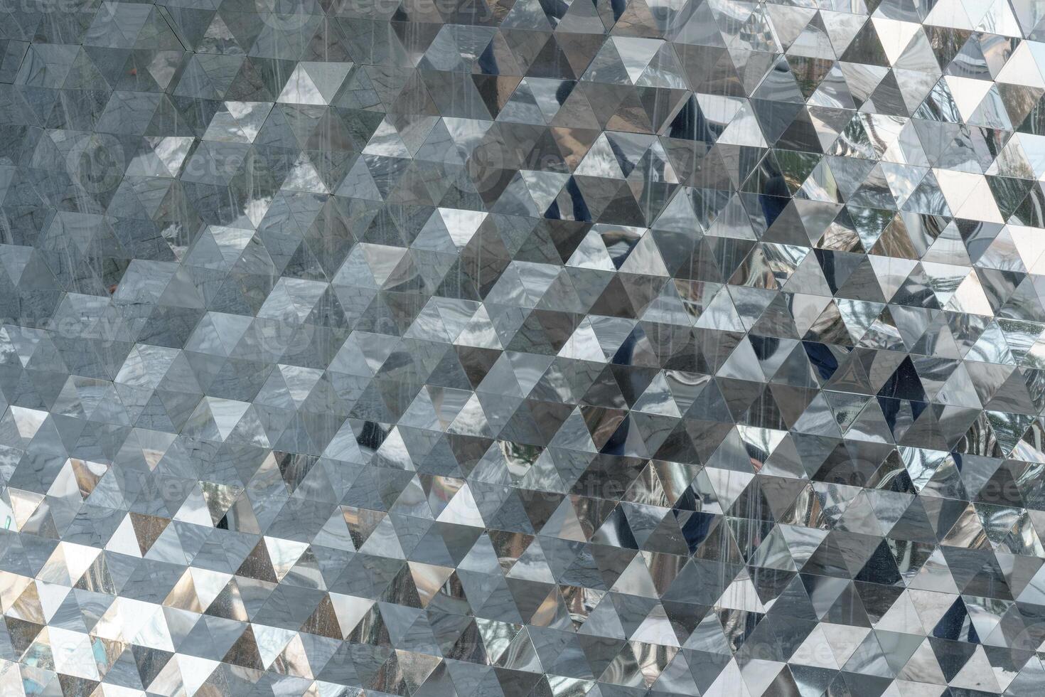 A large metal wall with many different shapes photo
