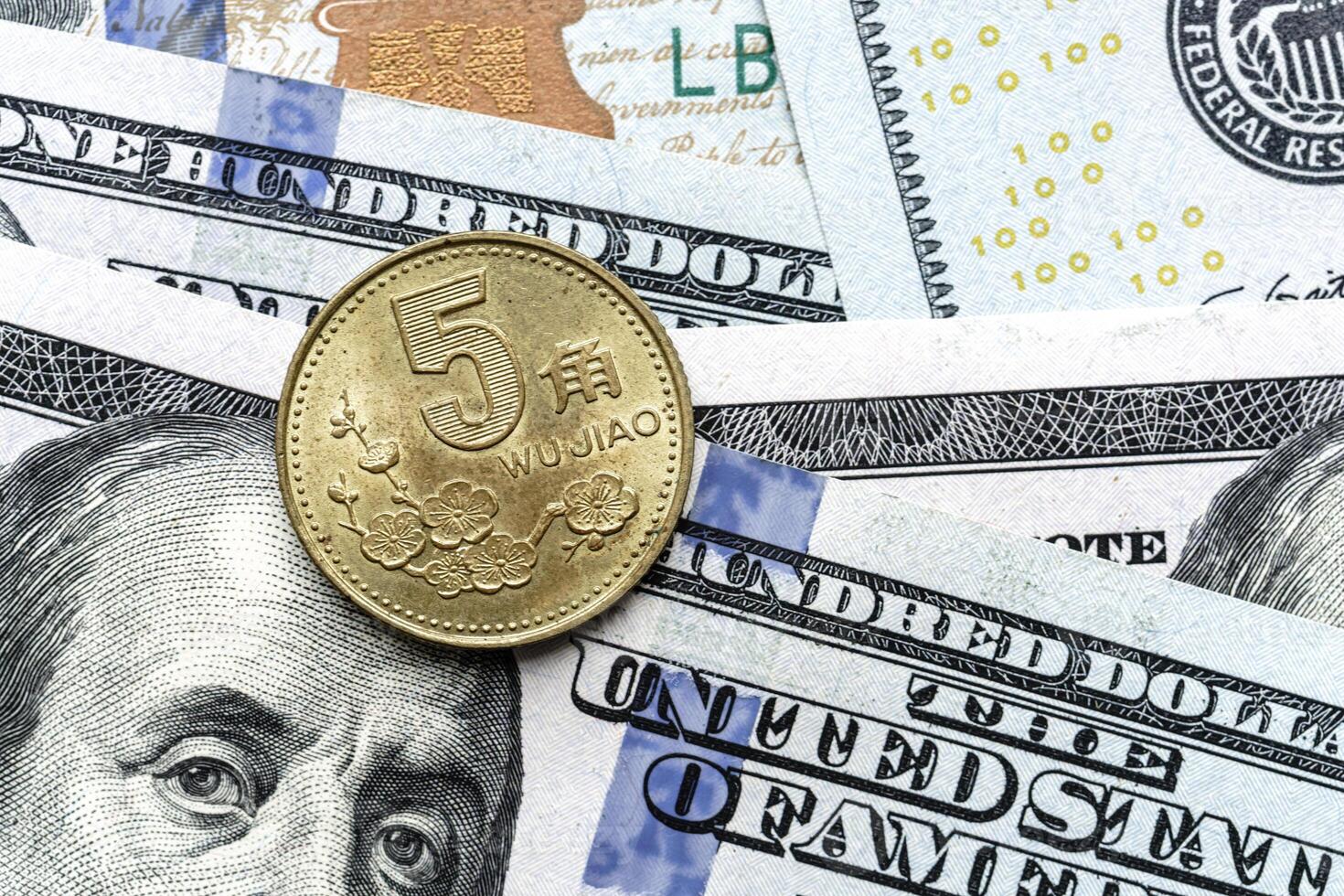 The us dollar is sitting on top of a pile of us dollars photo