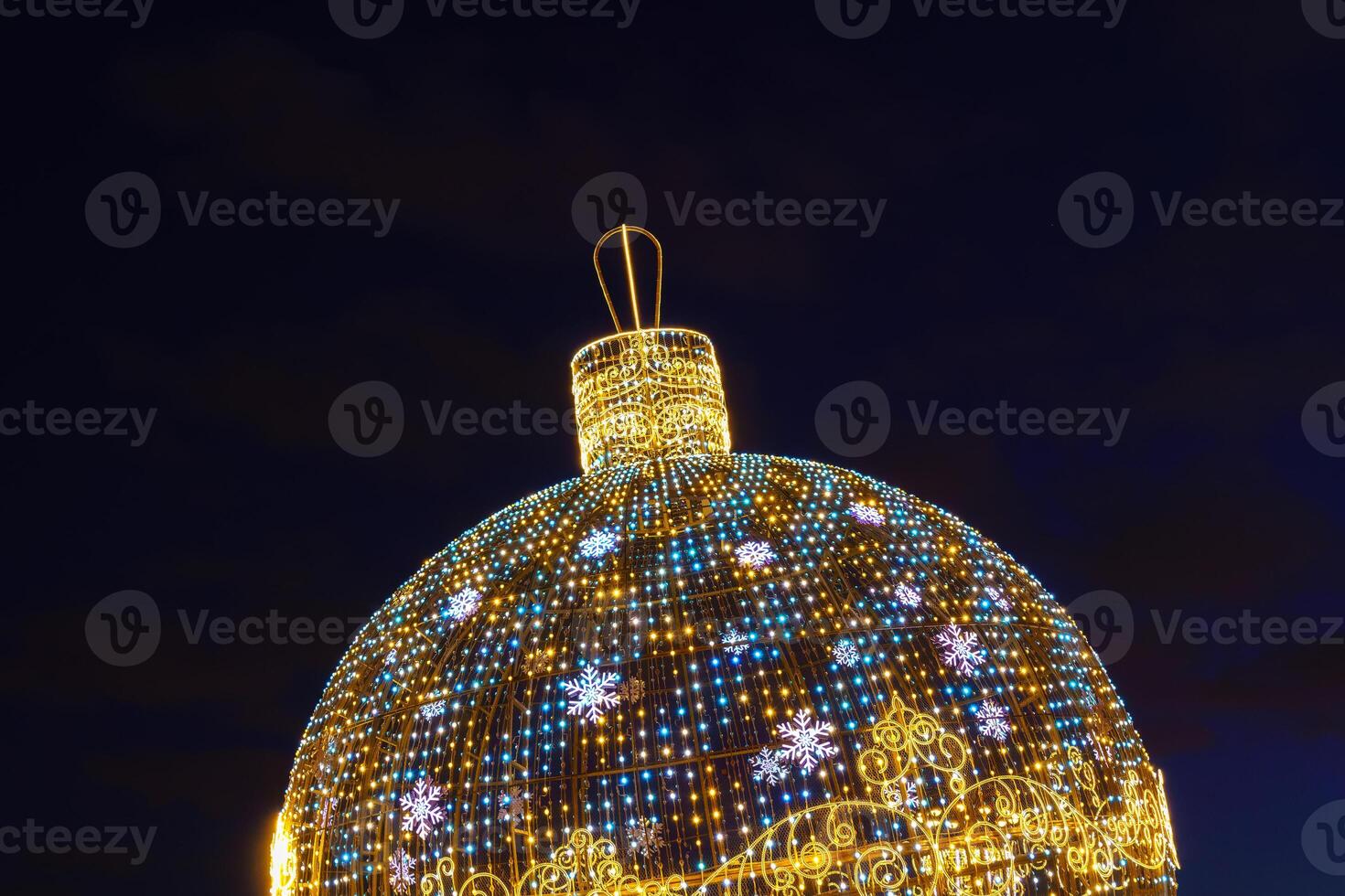 A large christmas tree with lights on it photo
