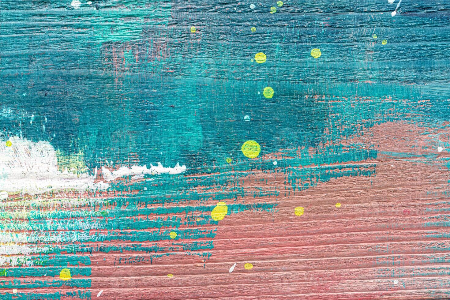A painting of a colorful abstract painting on a wooden surface photo