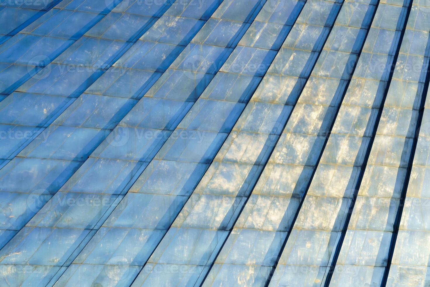 A blue building with a curved roof photo