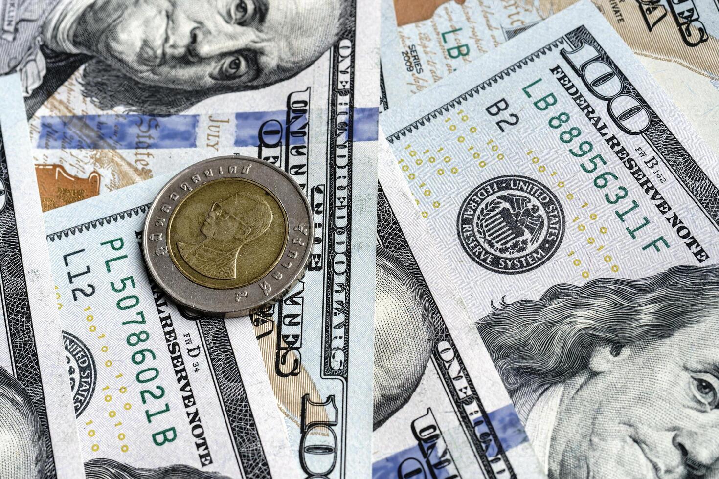 A close up of a dollar bill and a coin photo