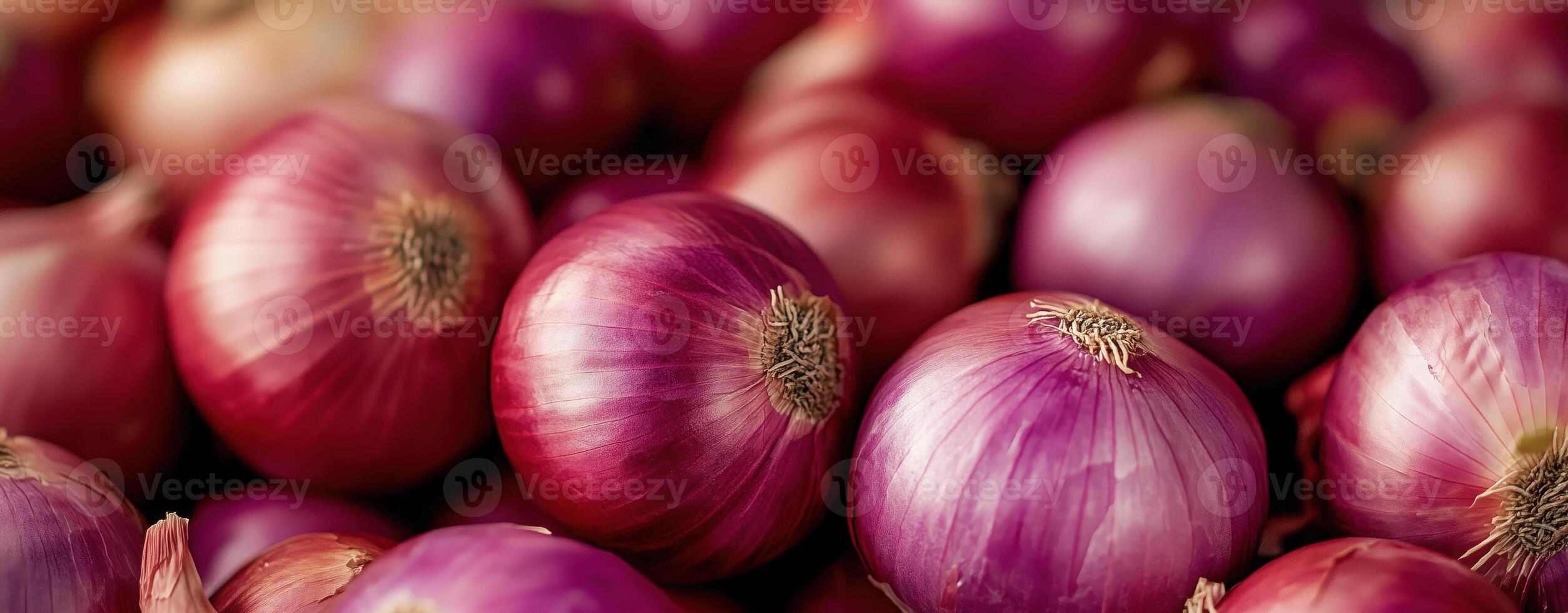 Close-up of fresh red onions with a glossy appearance, piled together, vibrant hues, natural texture photo