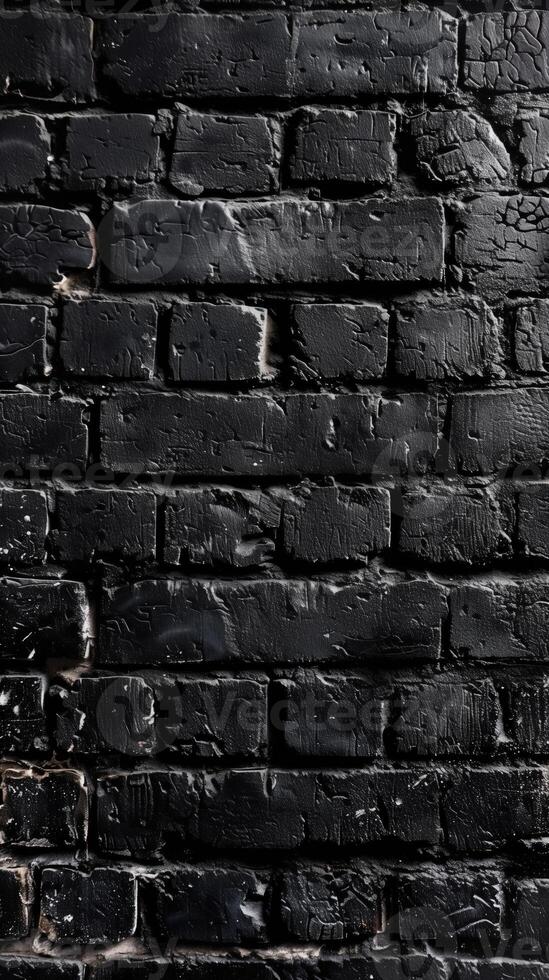Dark bricks with glossy, uneven black coating an urban, textured facade. photo