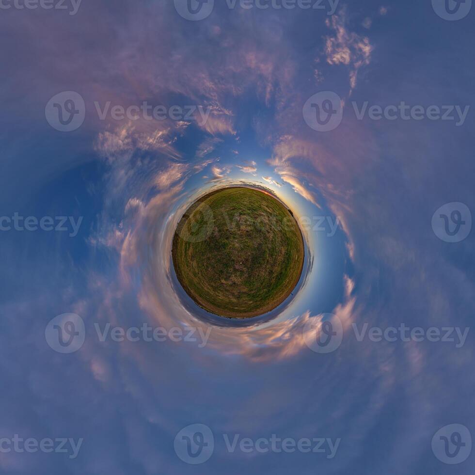 A small planet with a sky and clouds photo