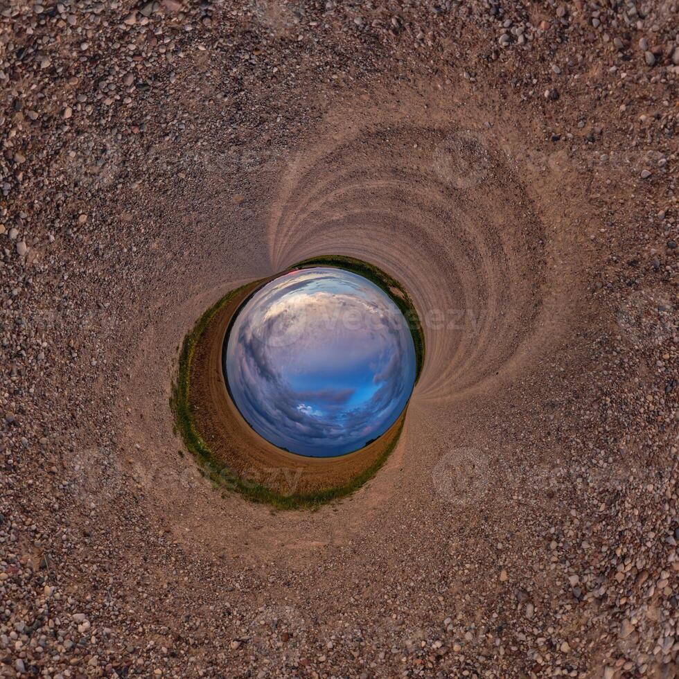 A view of a blue sky and a dirt road photo