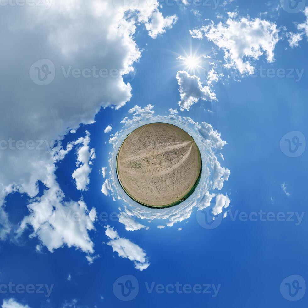 A small planet with clouds and sun in the sky photo