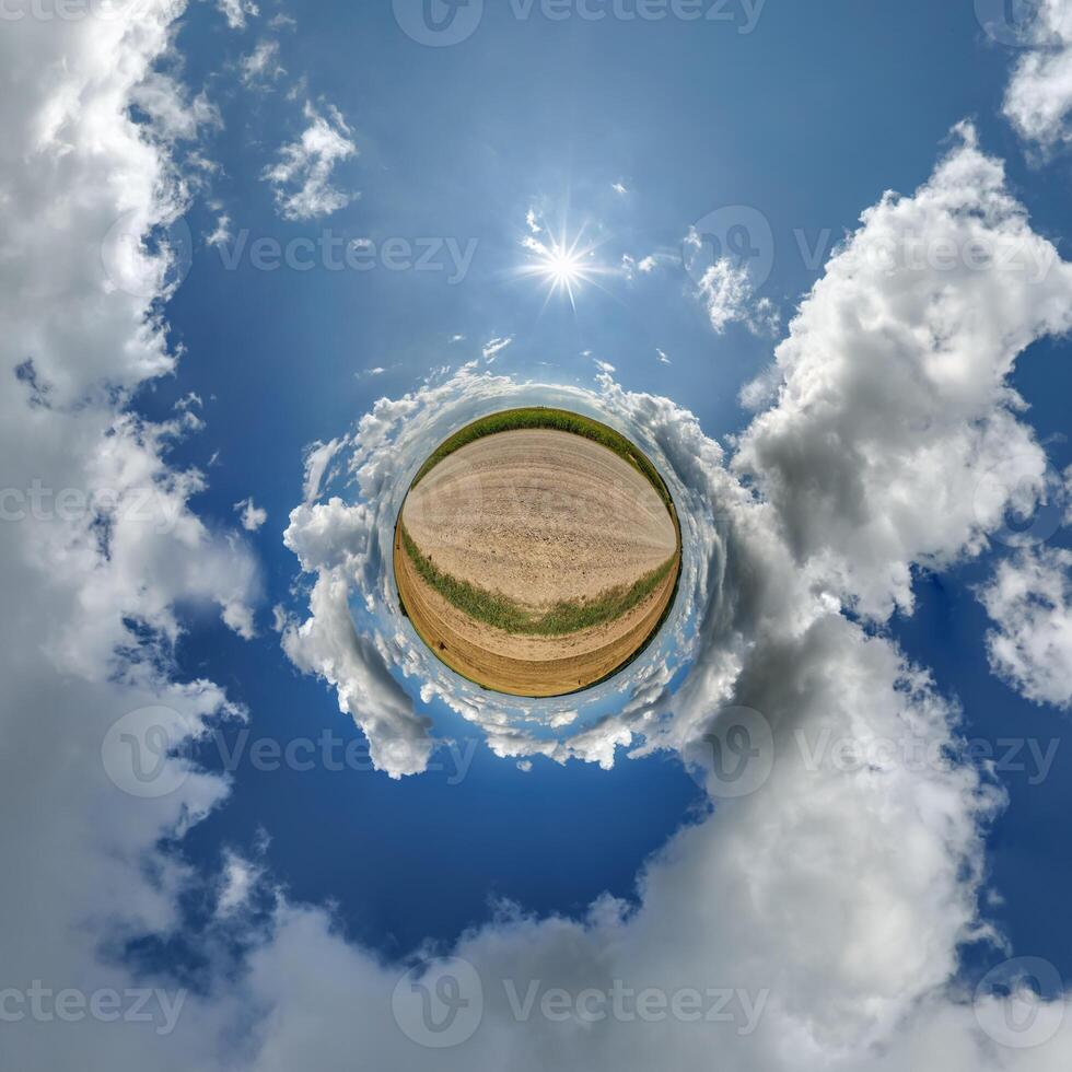 A small planet with clouds and sun in the sky photo
