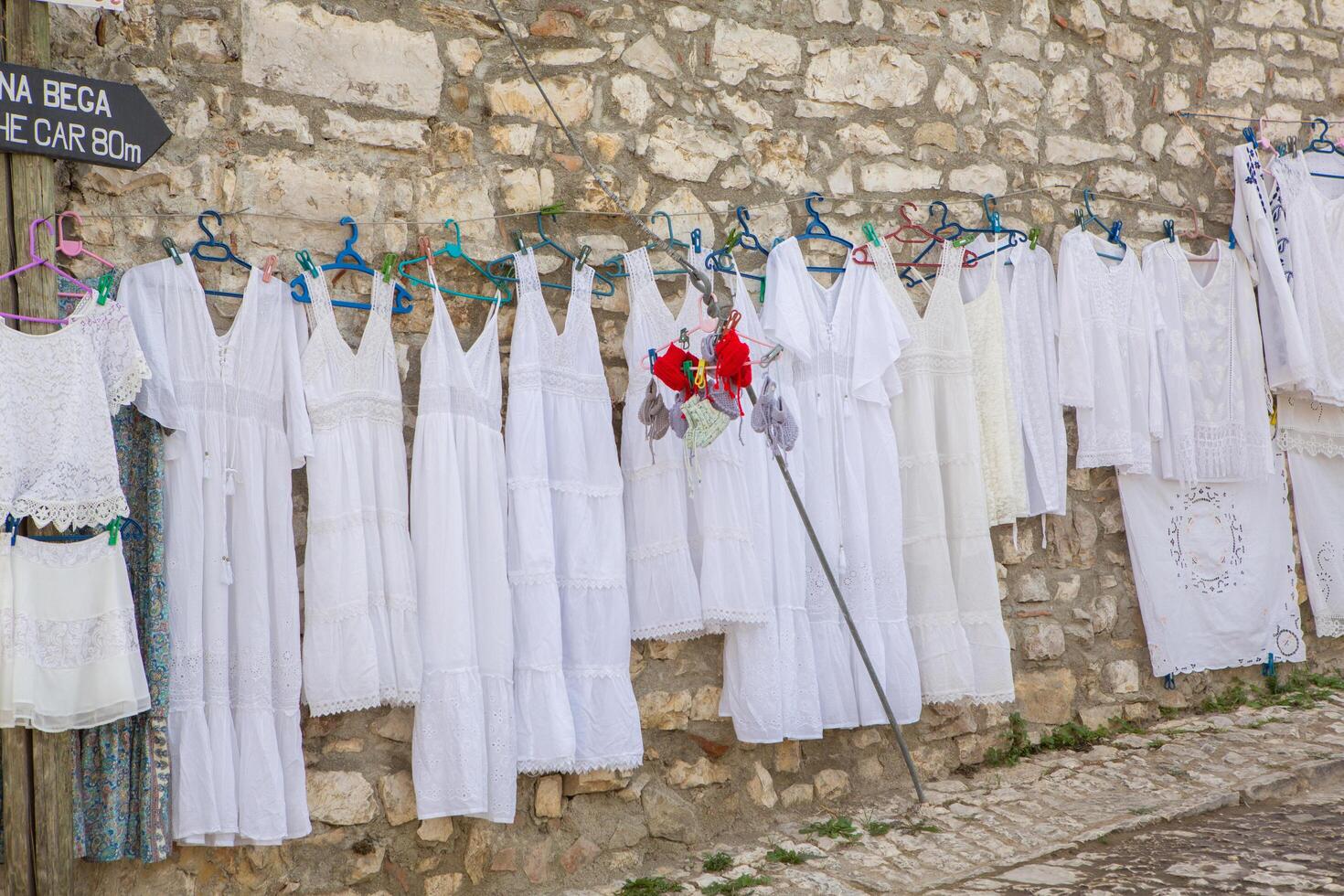 Berat, Albania September 11 2024 traditional white dress on the street in Berat Albania photo