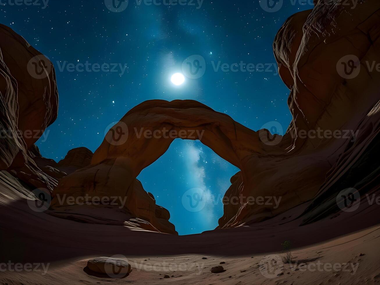 The moon is shining over a rock formation in the desert photo