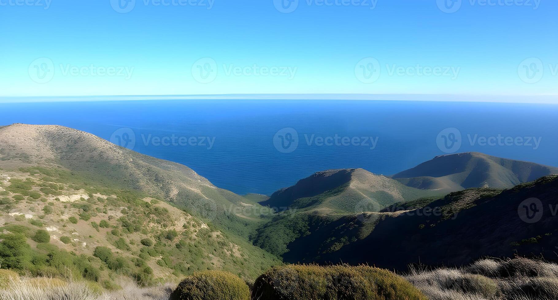 A view of the ocean from a mountain top photo