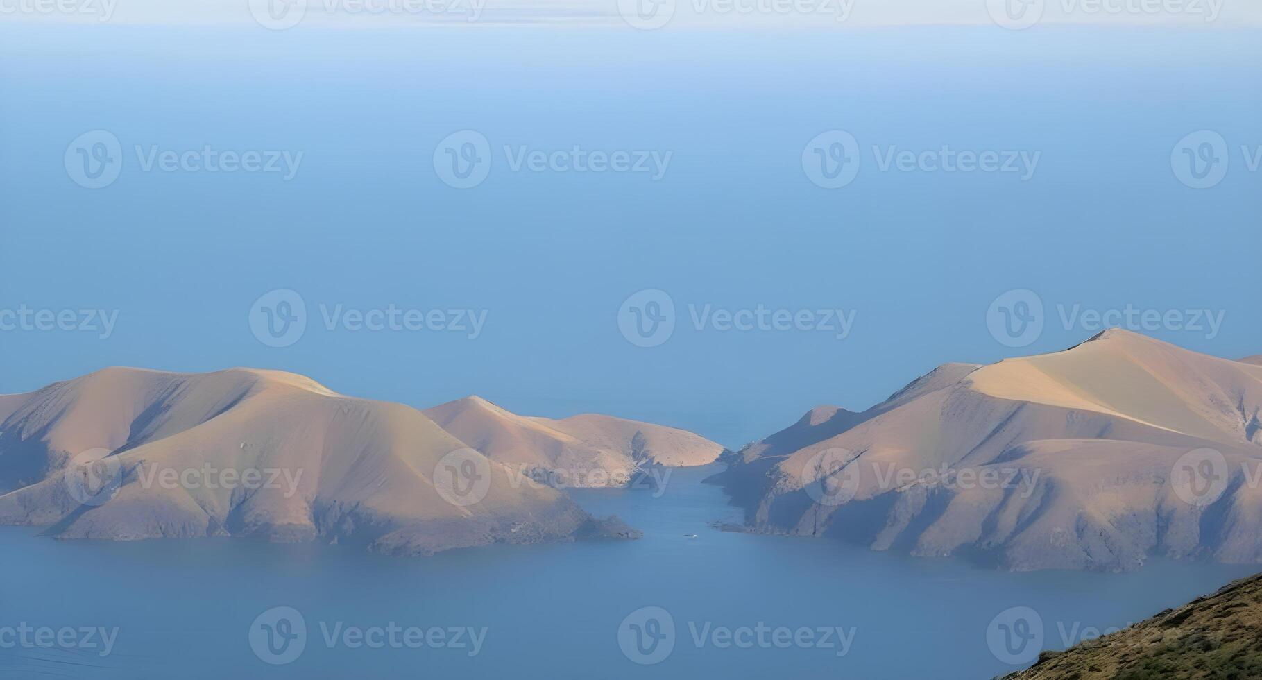 A view of some mountains in the ocean photo