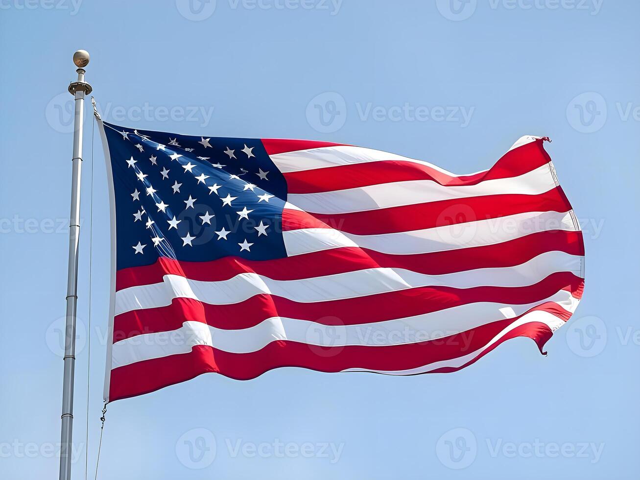 An american flag flying in the wind photo