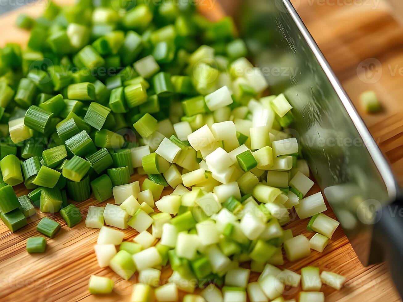Chopped green onions on a cutting board photo