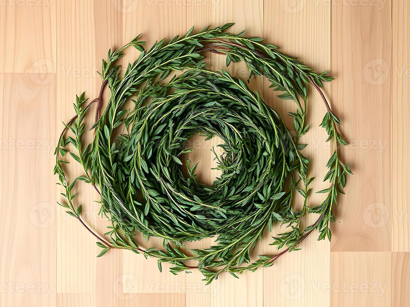 A wreath of fresh herbs on a wooden table photo