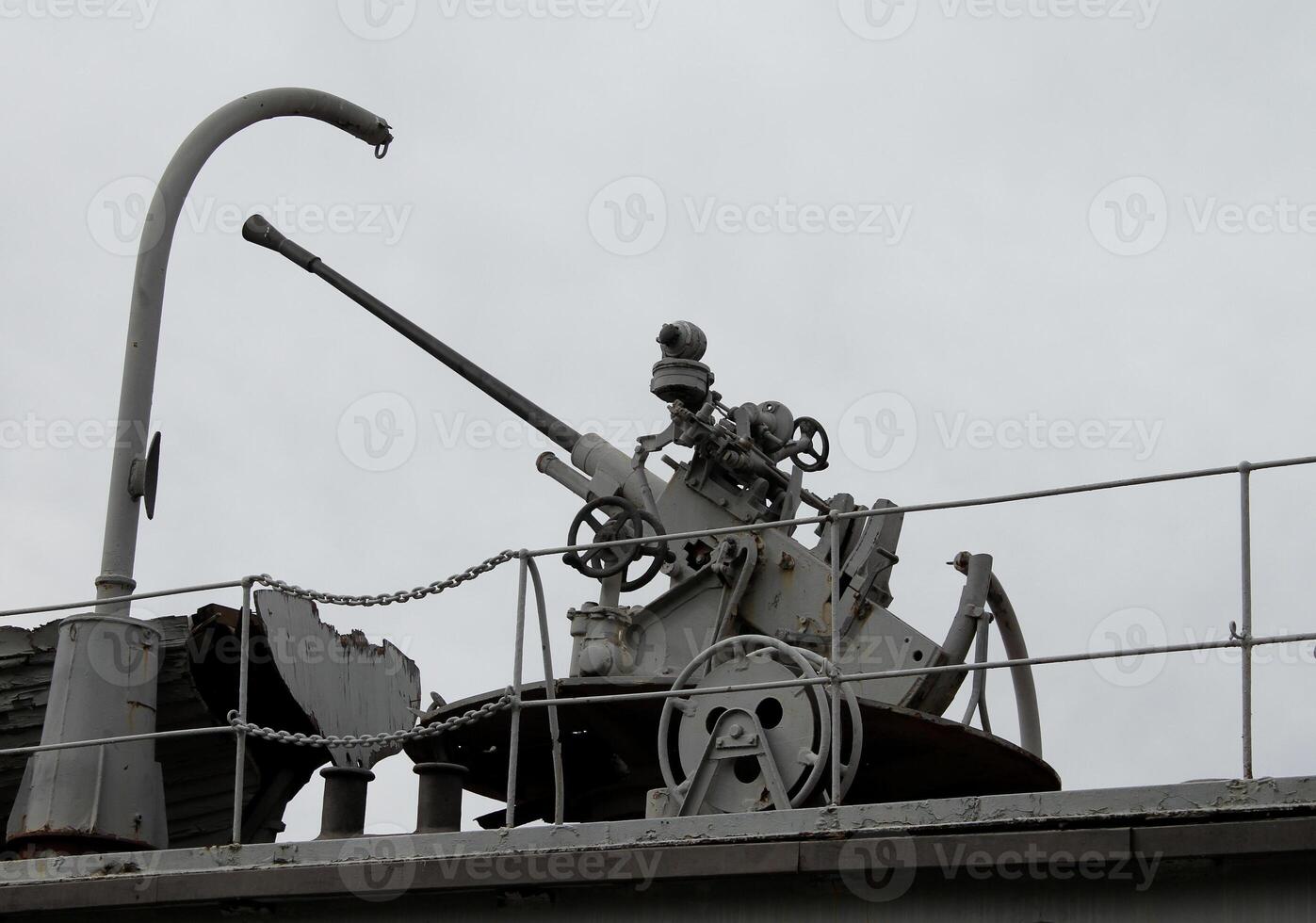Silhouette Of Heavy Gun On A Platform At Military Ship photo