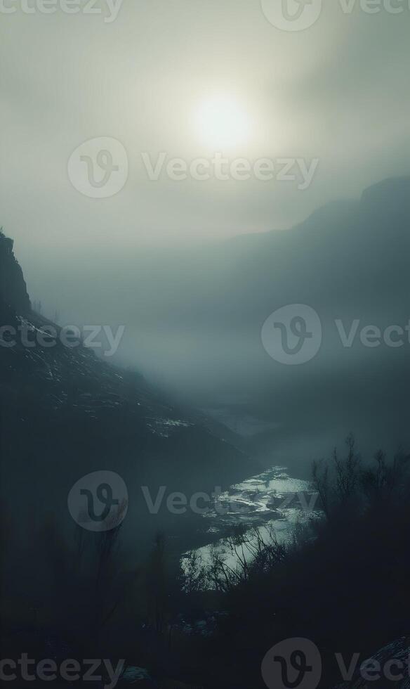 An atmospheric, mysterious landscape with heavy fog obscures the view of the mountains photo