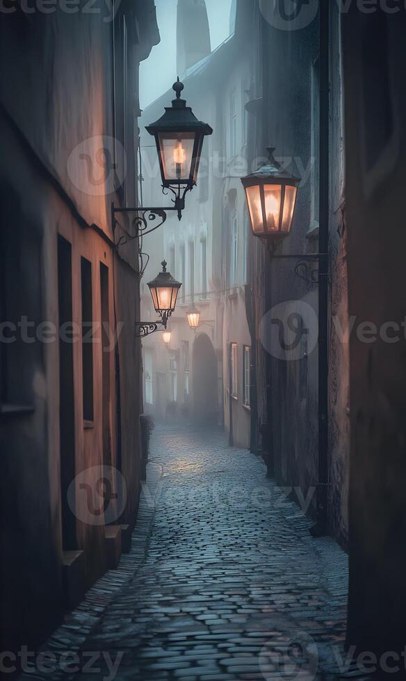 Mystical european alley with old cobblestone pavement and glowing lanterns in the mist photo