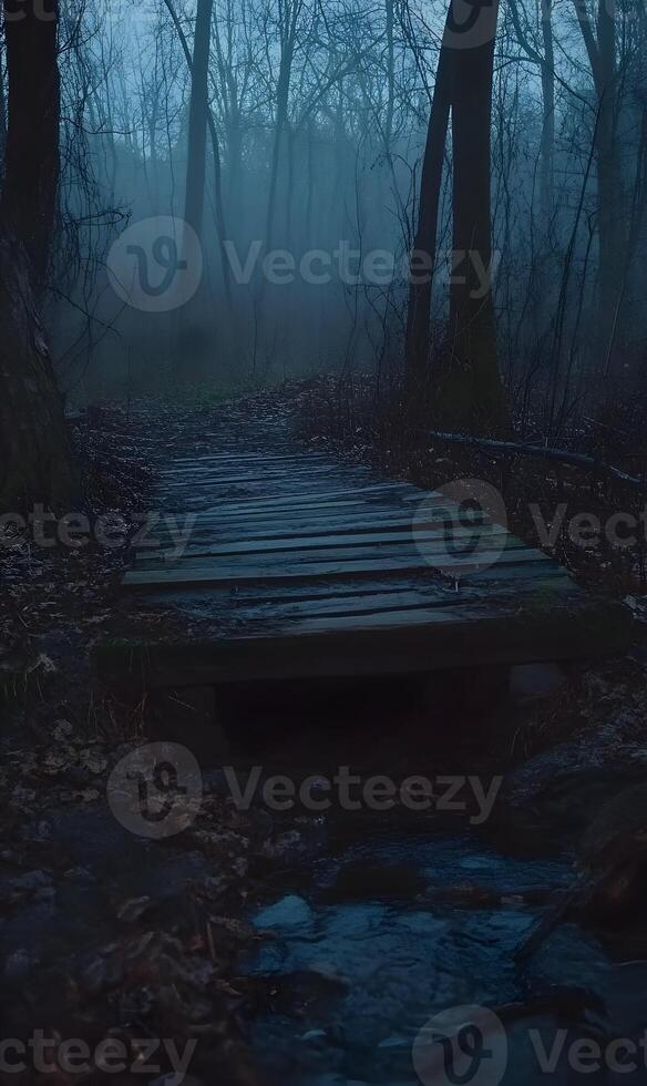 Eerie wooden path under a blanket of fog, leading deeper into the dark and mysterious forest photo