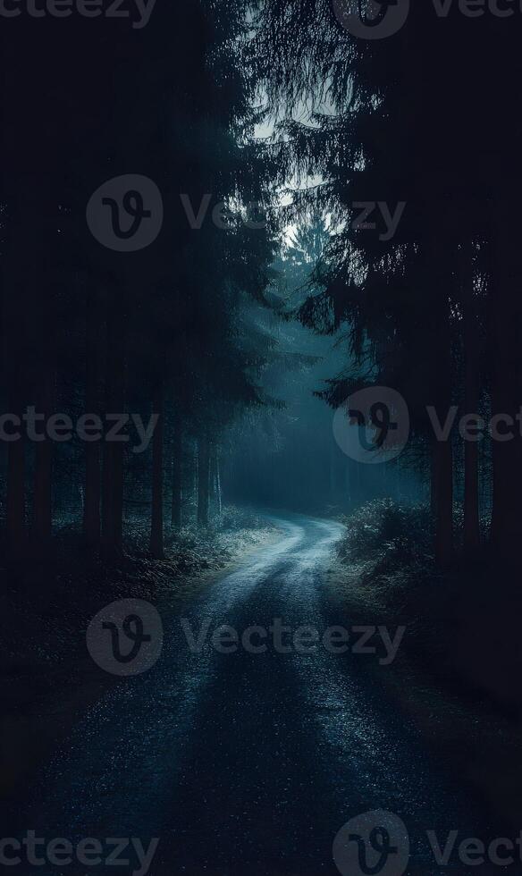 Mysterious winding road shrouded in a shadowy, dark forest at nightfall, perfect for ominous themes photo