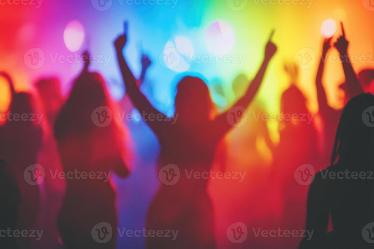 A Dancing silhouettes at vibrant celebration with colorful lights and energy. photo