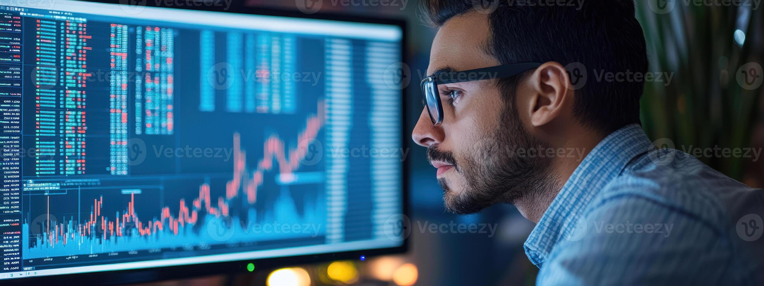 financial expert analyzing market trends on computer, showcasing analytical side of financial services and investment photo