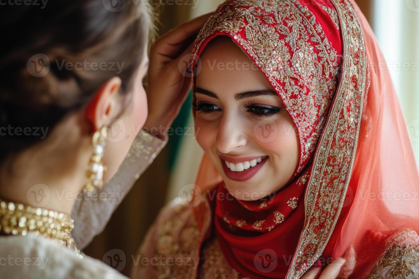 A woman in a traditional muslim wedding dress is smiling photo