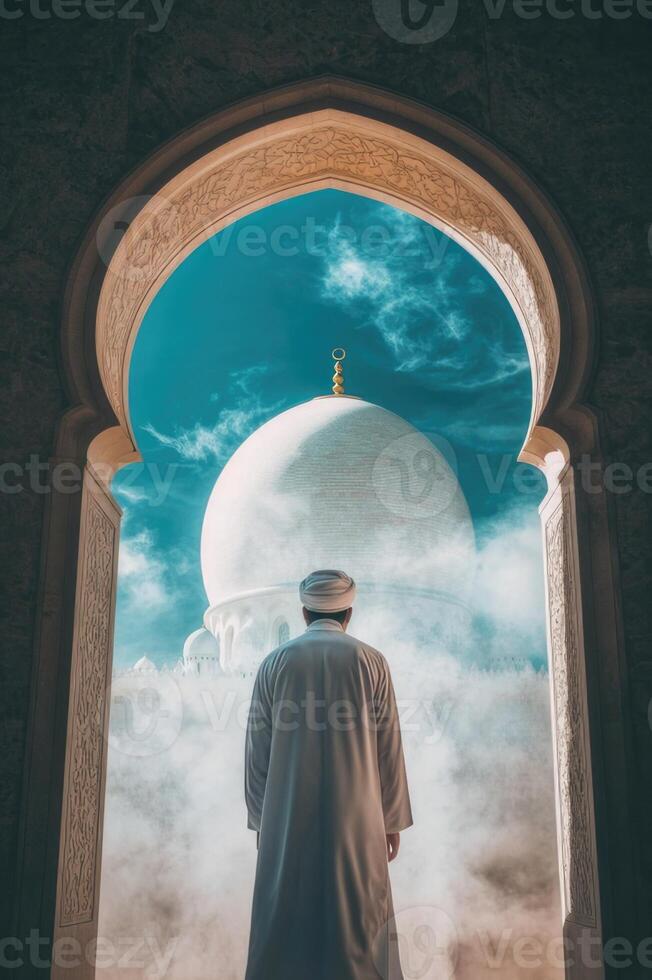 Man in white standing in front of mosque photo