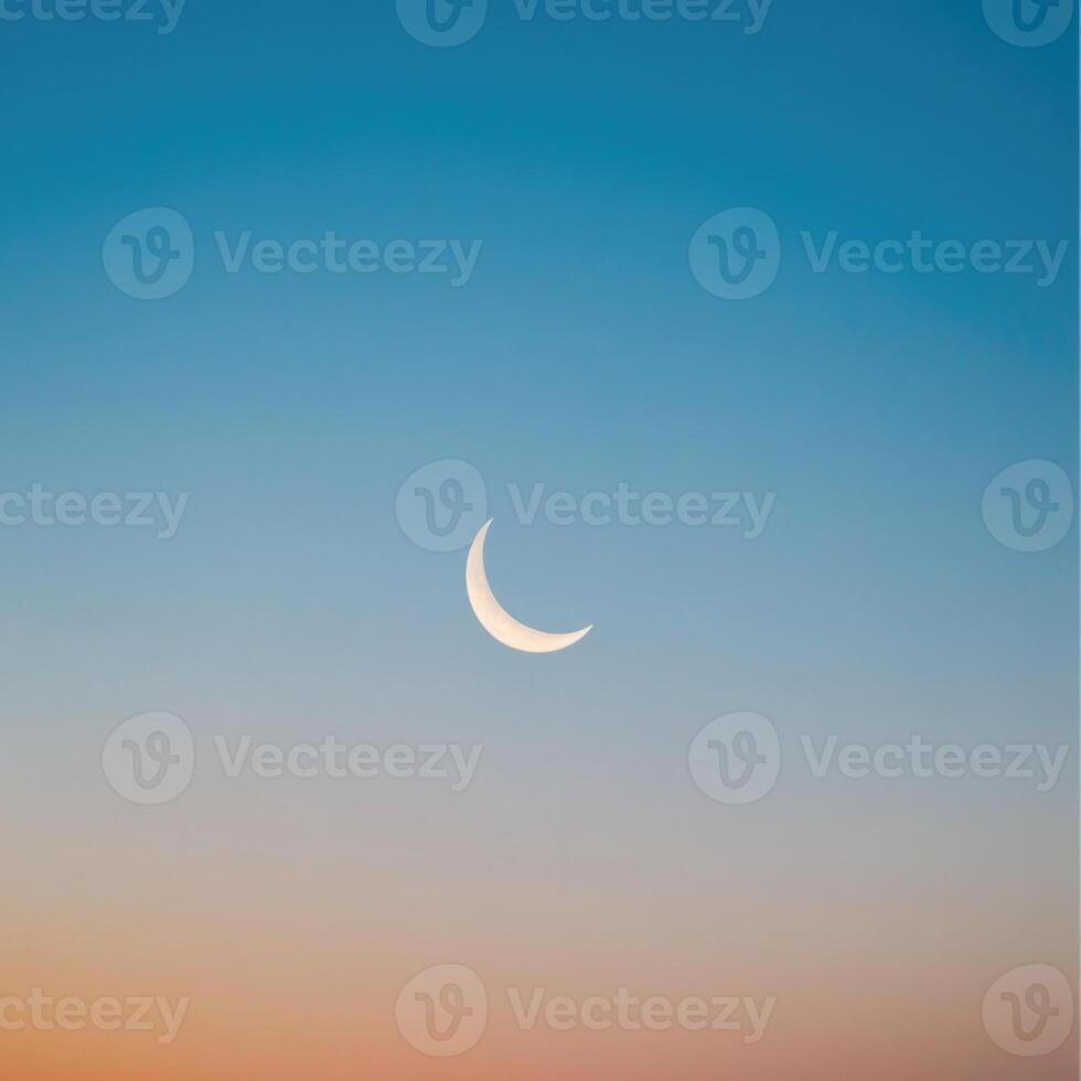 The moon is seen in the sky at sunset photo