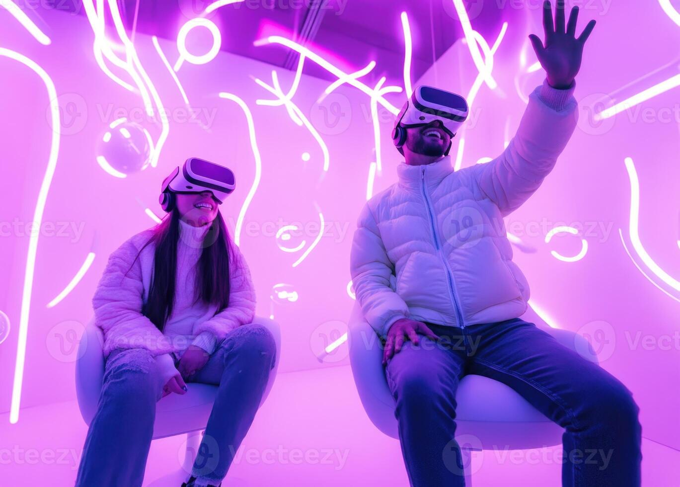 Two people wearing virtual reality headsets in a room photo