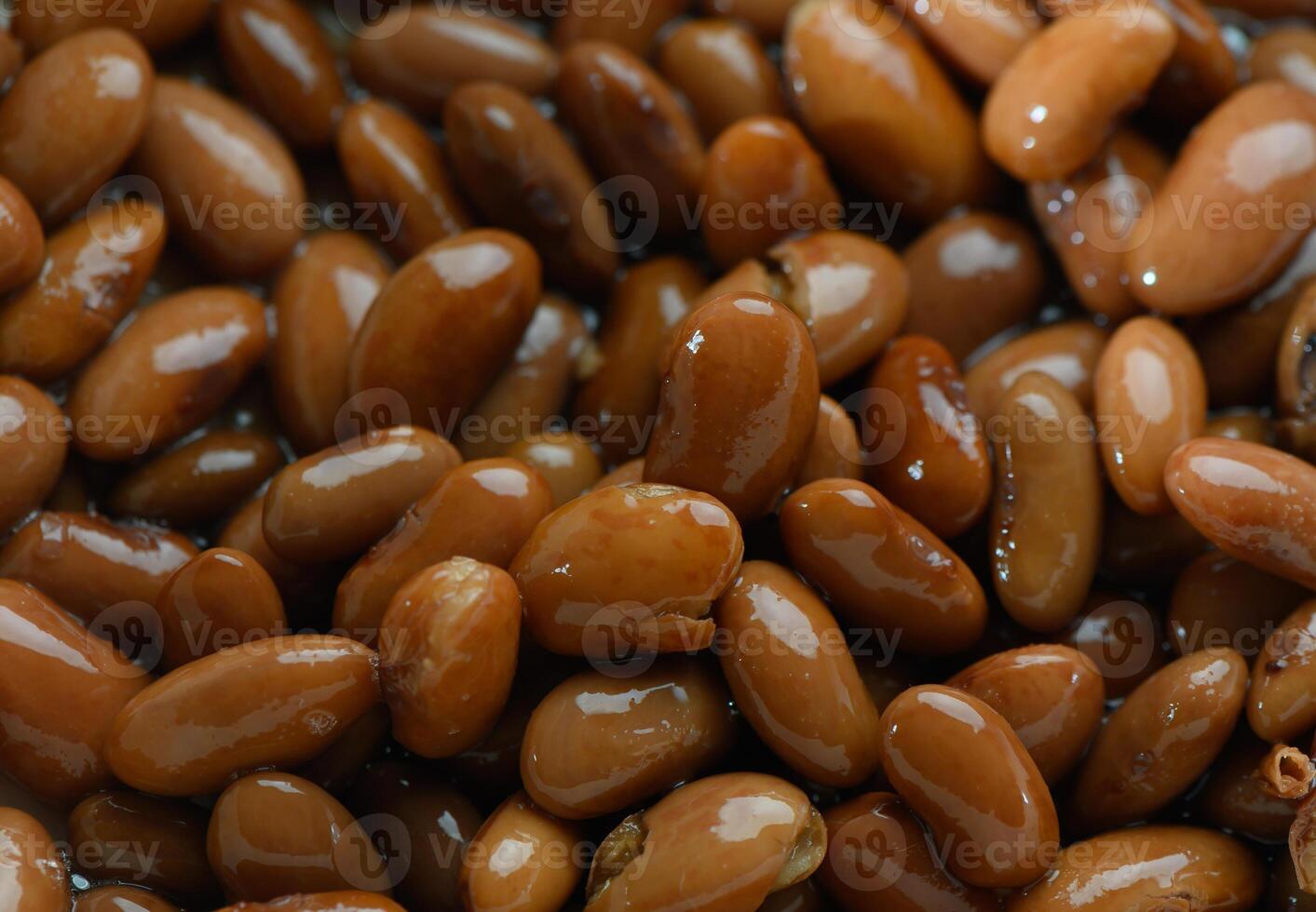 Brown beans basking in natural light, highlighting their smooth texture and rich color in a close-up view photo