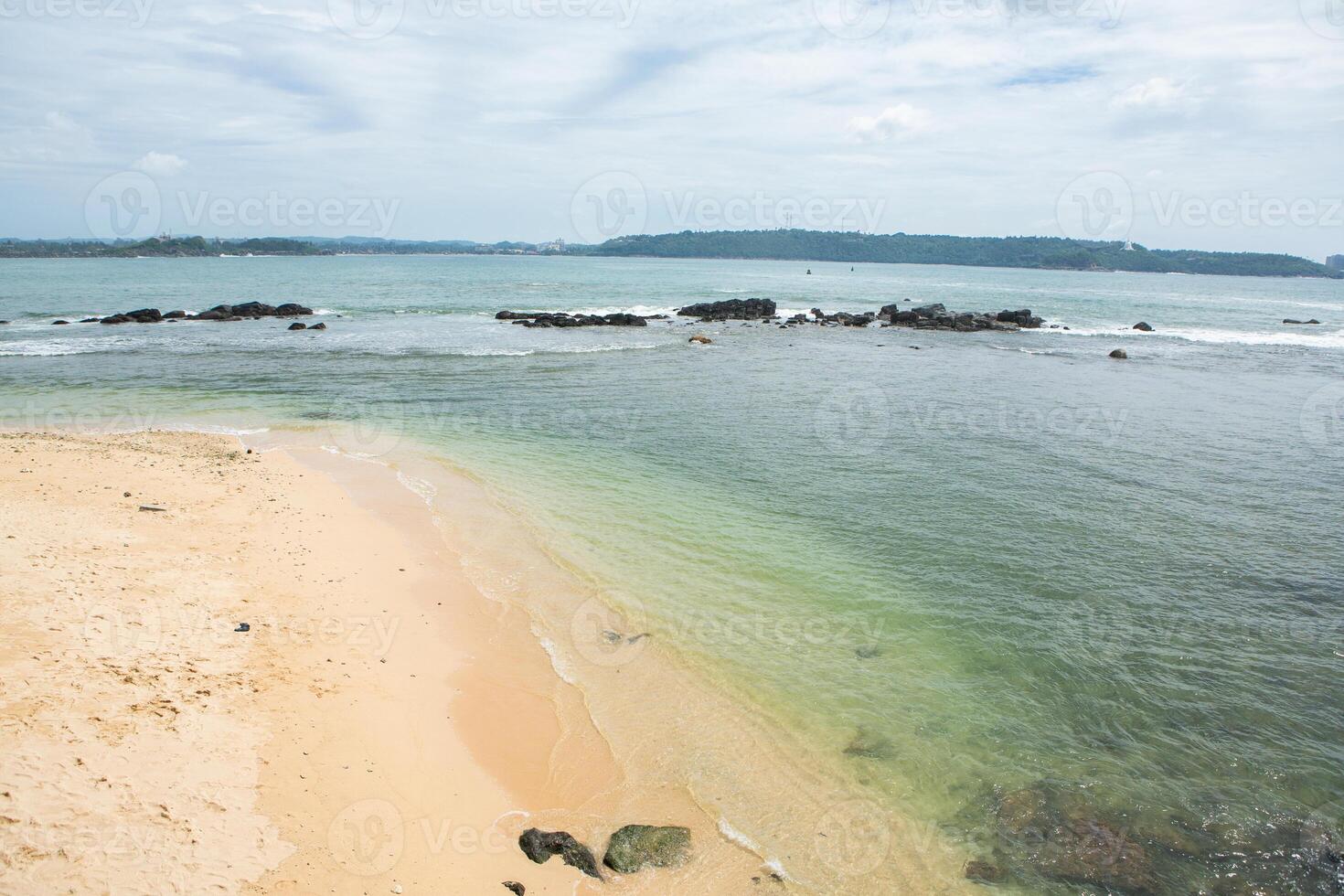 clear and blue water on the indian coast in fort galle in sri lanka. photo